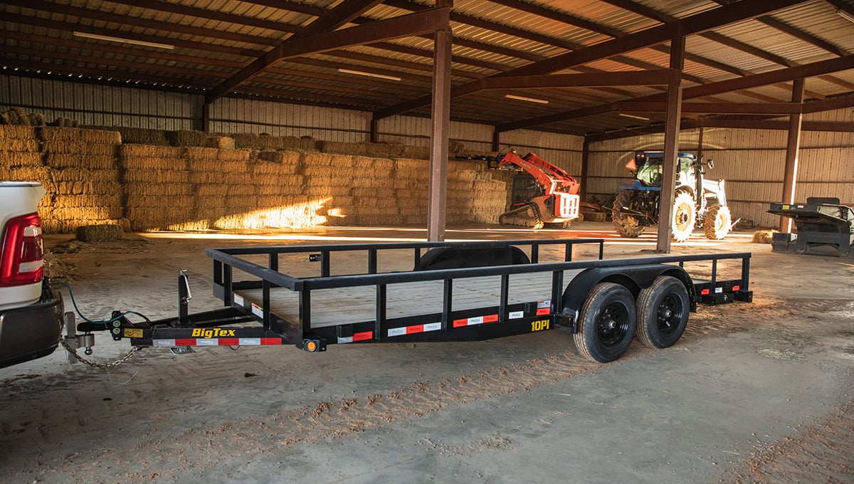 a 10pi utility big tex trailer is parked in a warehouse
