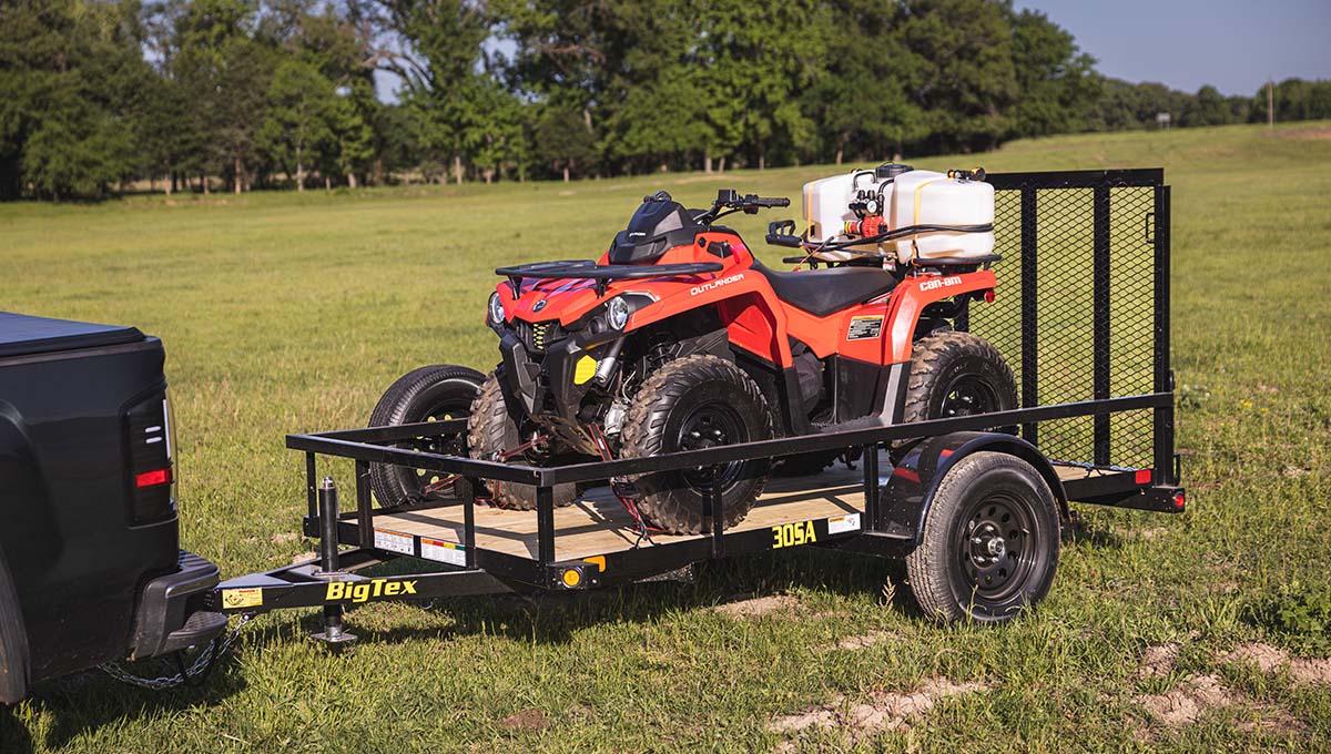 a can-am atv is on a trailer that says big tex