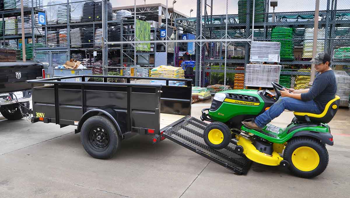 a john deere lawn mower is being towed by a 30sv vanguard trailer