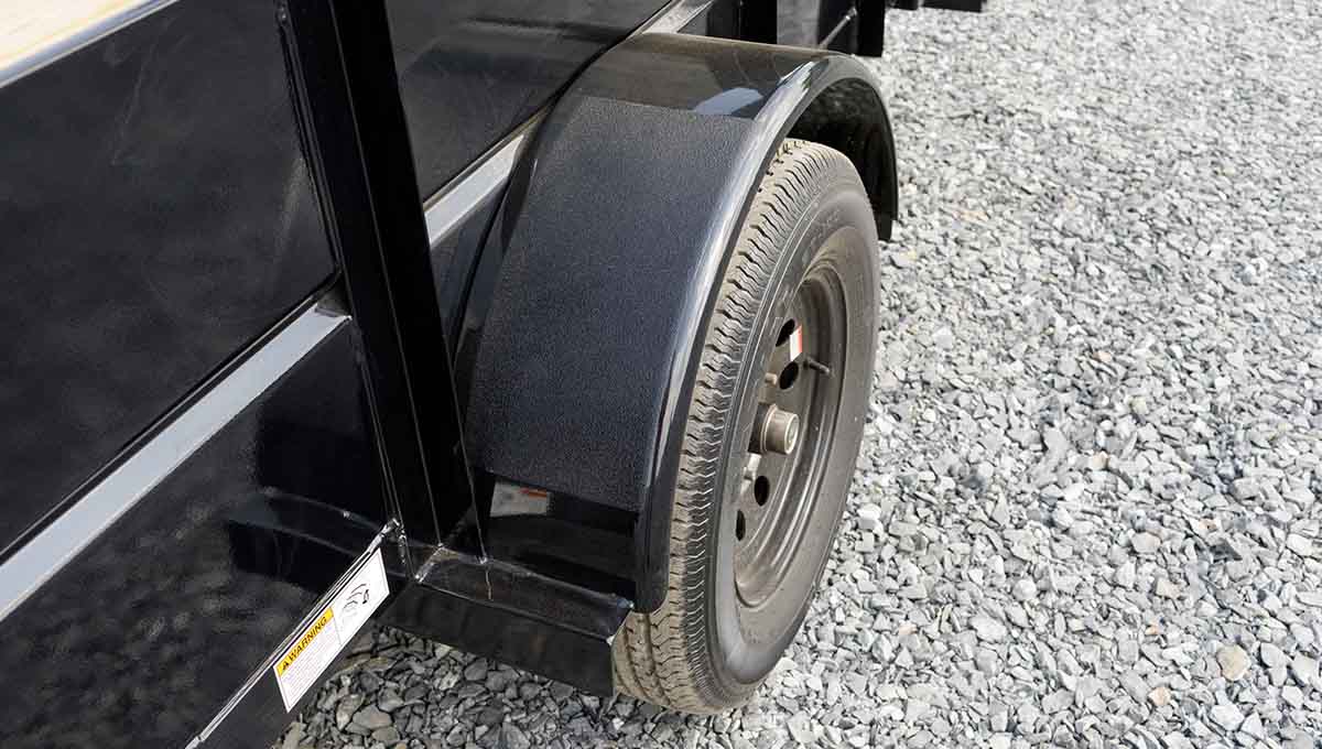 a black 35sv trailer with a warning sign on the side of it