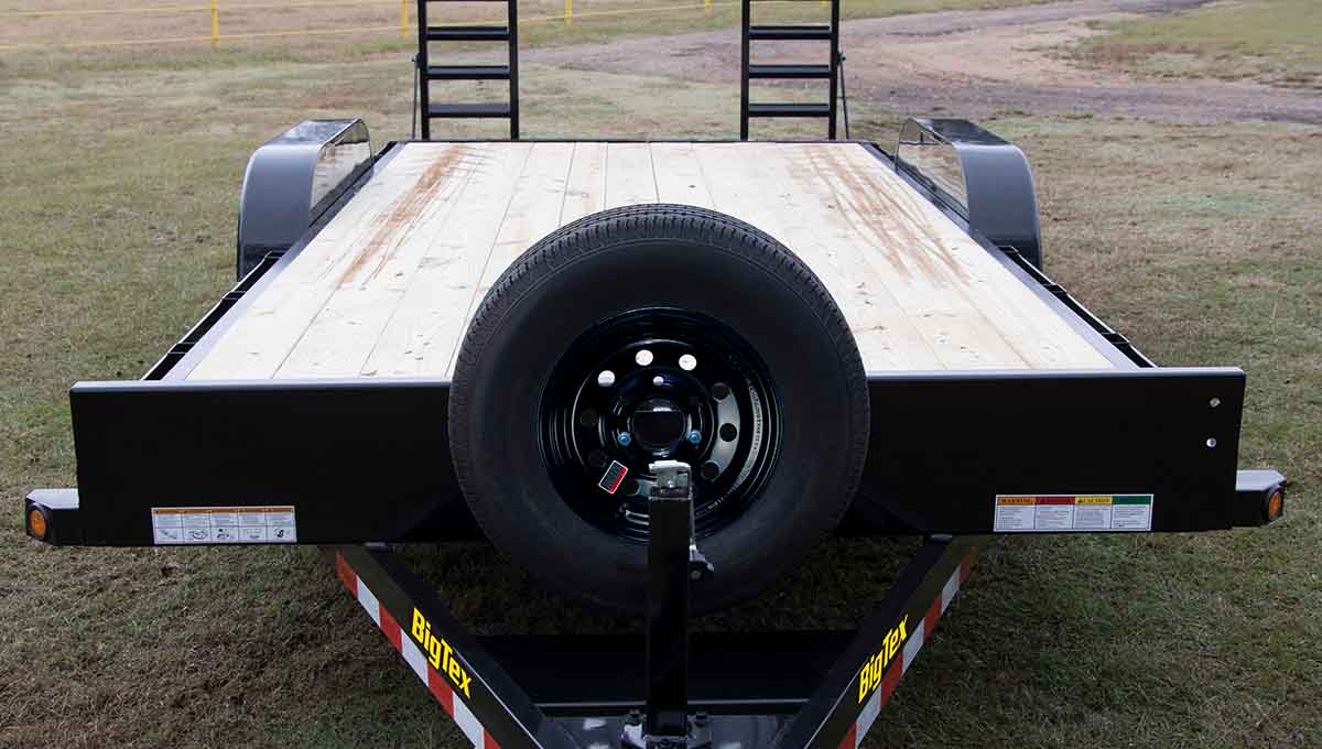 a big tex 10et equipment hauler trailer with a spare tire attached to it