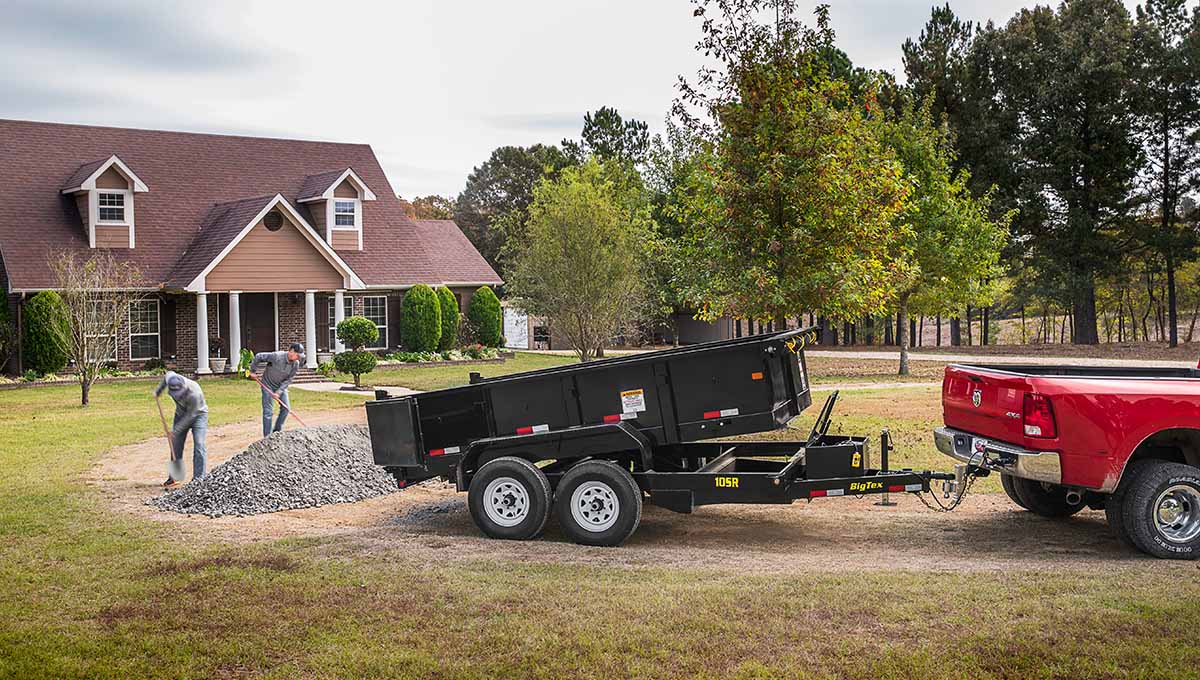 a 10sr commercial dump trailer is being pulled by a red truck