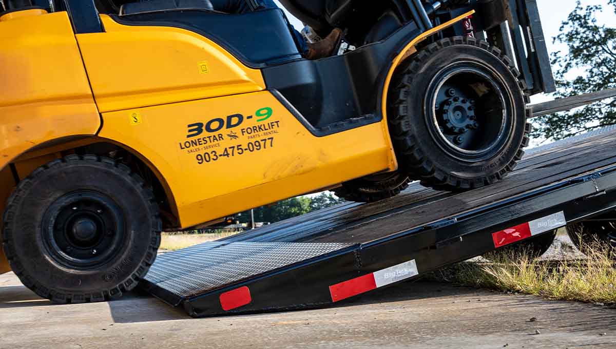 a yellow forklift from lonestar forklift is on a ramp