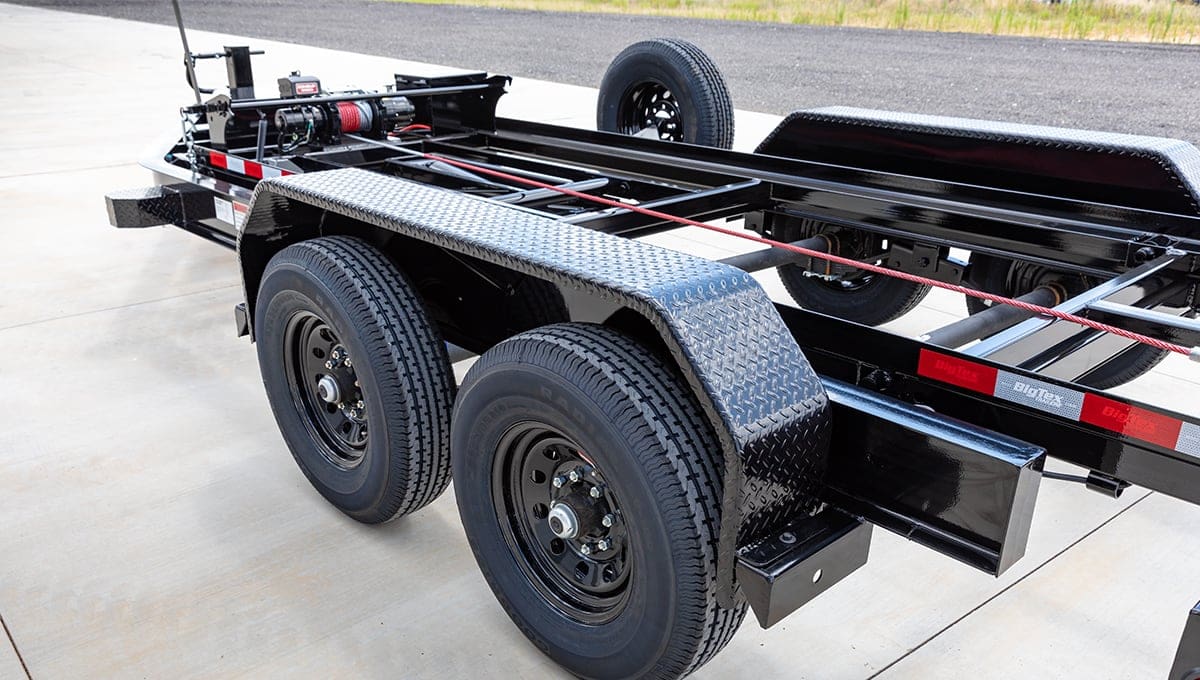 a black trailer with a sticker that says ' heavy duty ' on it