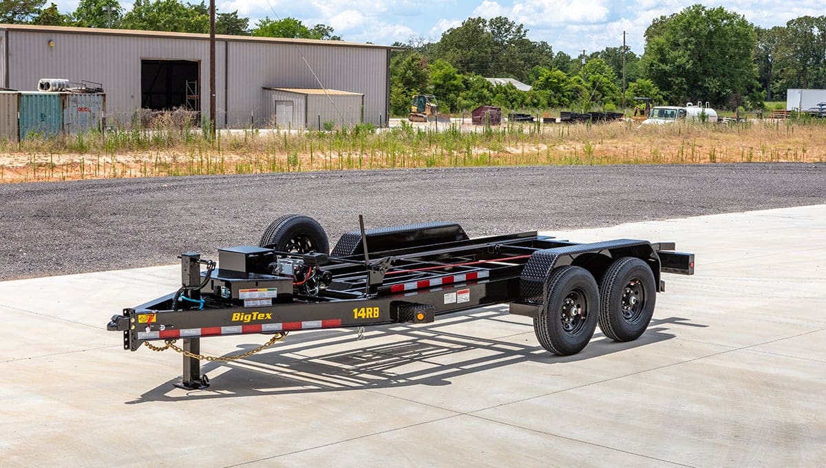 a 14rb dump big tex trailer is parked on the side of the road