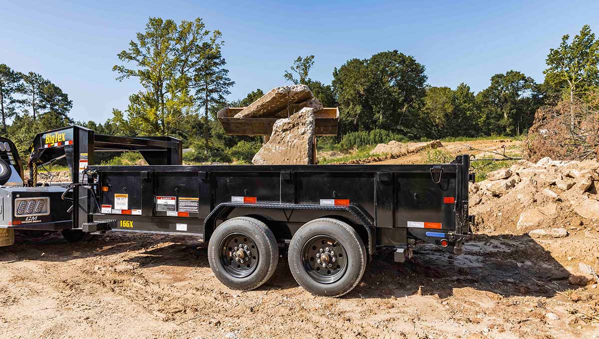 a 16gx commercial grade dump trailer with the word dumpster on the side