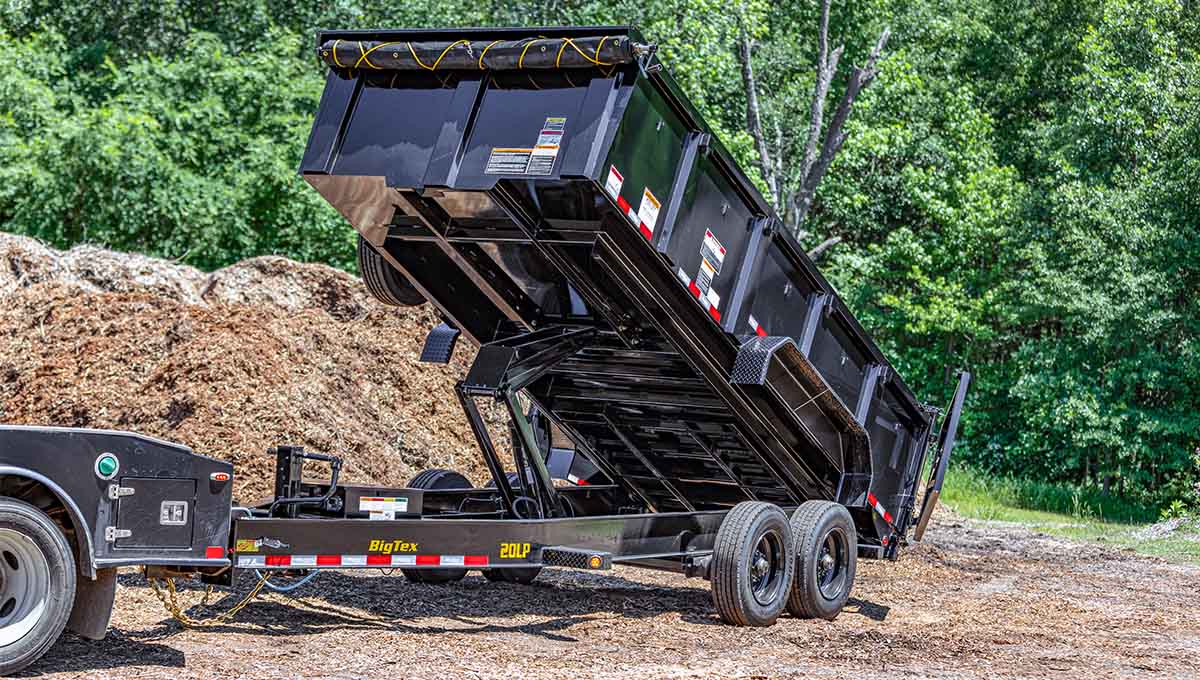 a 20lp commercial grade dump trailer with the word big tex on the side