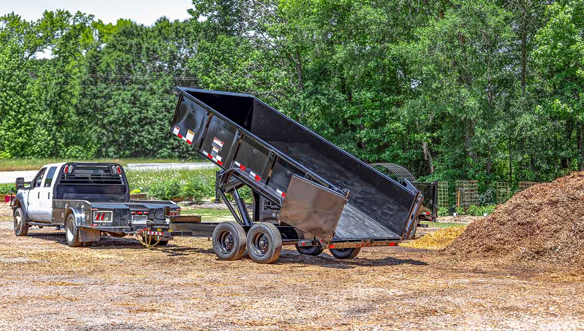 a 20lp dump trailer is being towed by a truck