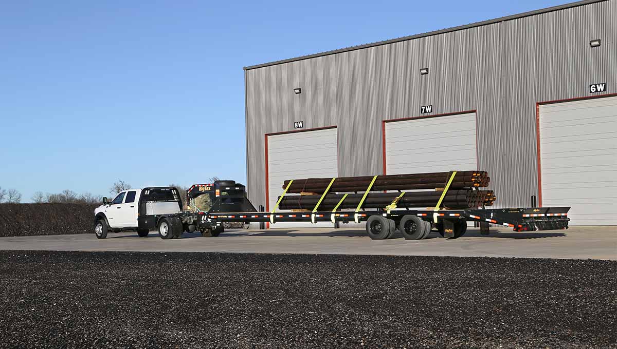 25GN Flatbed Gooseneck Trailer Transporting Materials