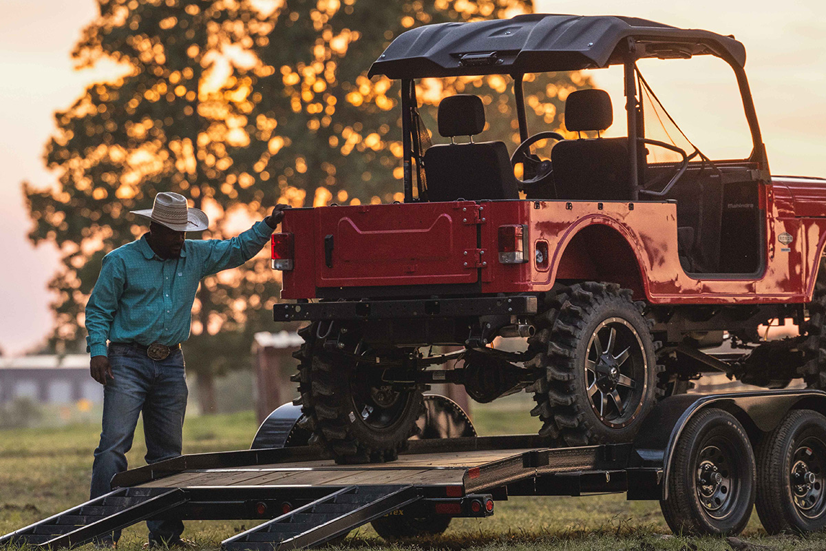 Big Tex Car Hauler Transporting a Red Jeep