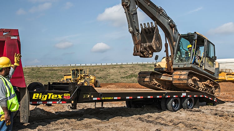 Big Tex Deck Over Tag Along Trailer Carrying Excavator