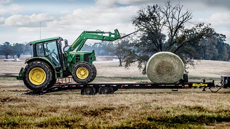 Big Tex Deckover Pintle Trailer Carrying Farm Equipment