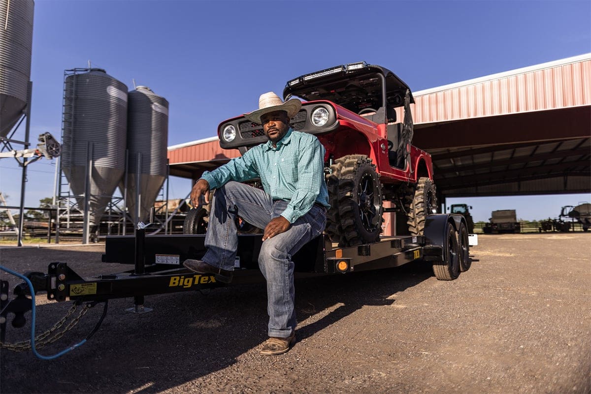 Man Sitting on Big Tex Trailer